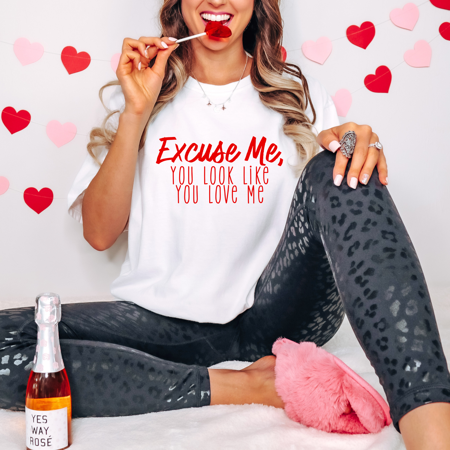 Classic white Valentine’s Day tee with the playful phrase 'Excuse Me, You Look Like You Love Me' in bold red lettering. A charming and versatile addition to your festive wardrobe.