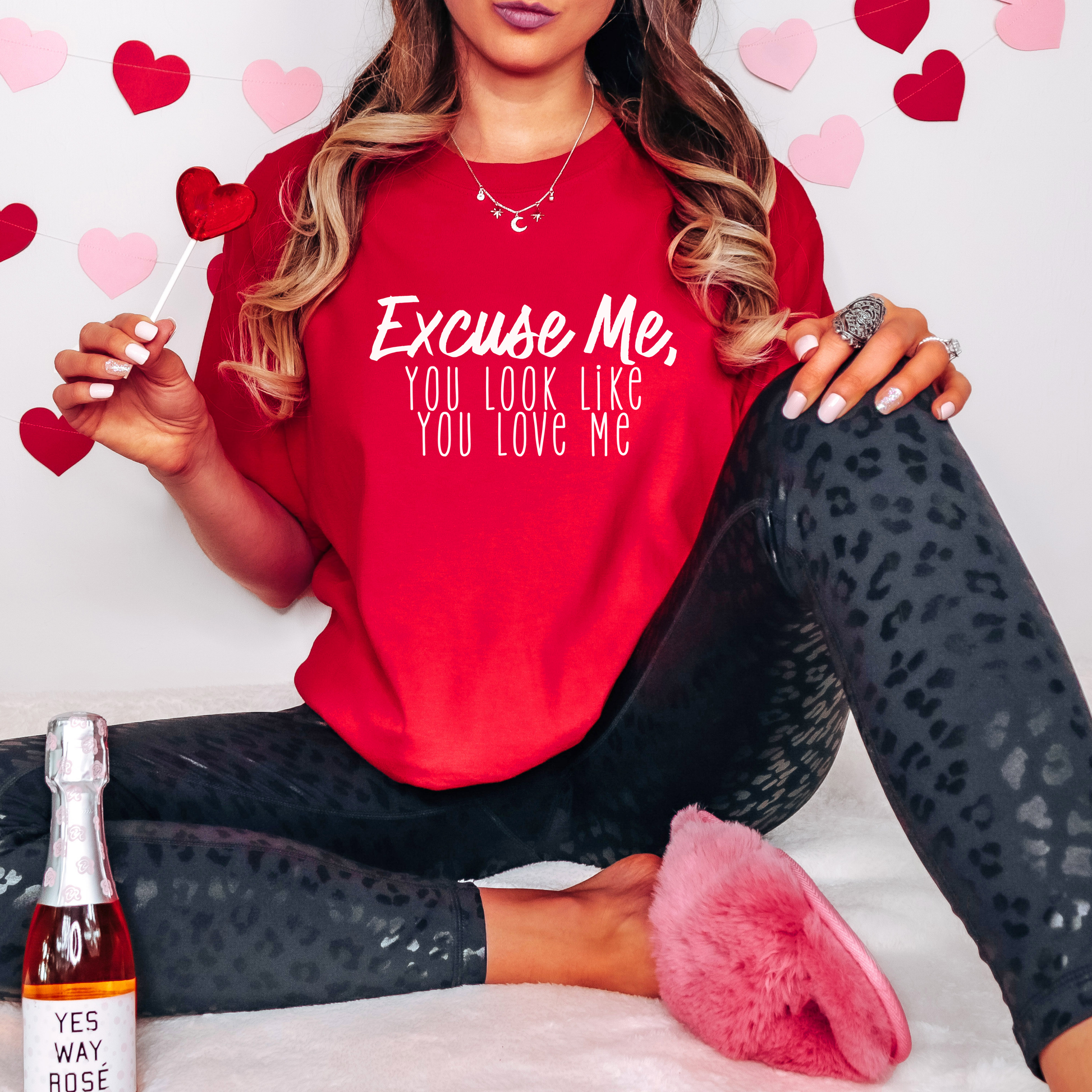 Bold red Valentine’s Day tee featuring the fun text 'Excuse Me, You Look Like You Love Me' in white lettering. A perfect festive statement piece for casual outings or celebrations.