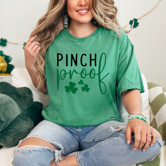 Heather kelly green graphic tee featuring the text 'Pinch Proof' with shamrock accents.