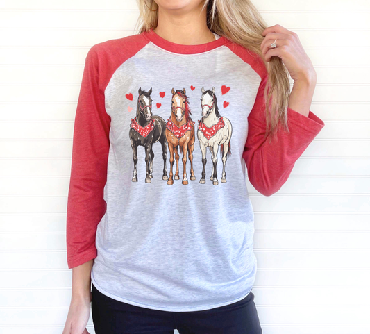 Gray and red raglan tee featuring three horses wearing red Valentine bandanas with heart accents.